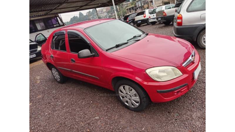 CHEVROLET - PRISMA - 2009/2009 - Vermelha - R$ 24.000,00